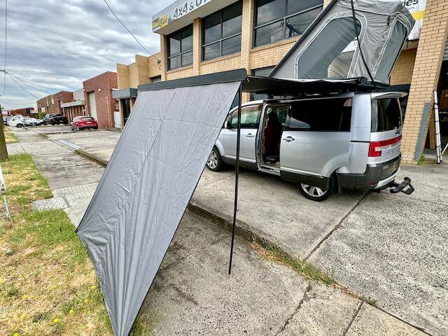 Car awning setup on a vehicle for outdoor adventures, illustrating the essential guide to choosing the right car awning.