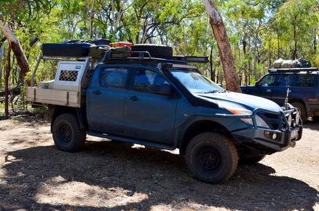BT50 Bullbar equipped vehicle for off-road adventure in a forest setting