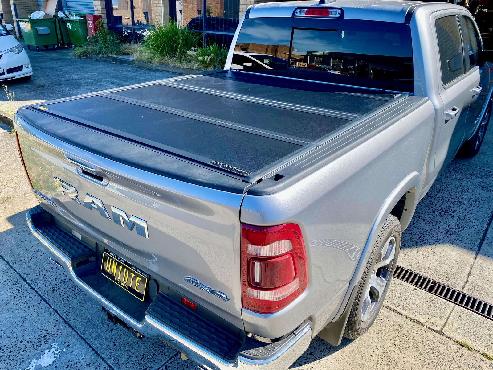 Silver Ute with installed Ute Tonneau Covers in a parking area