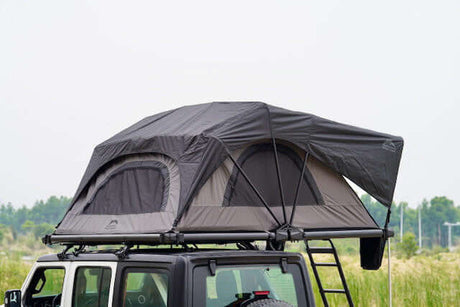 Outdoor adventure with UniUte's durable roof top tents on a rugged vehicle, combining comfort and style for camping enthusiasts.