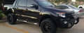 Black 4x4 vehicle with UniUte NUDGE BARS for enhanced style and protection
