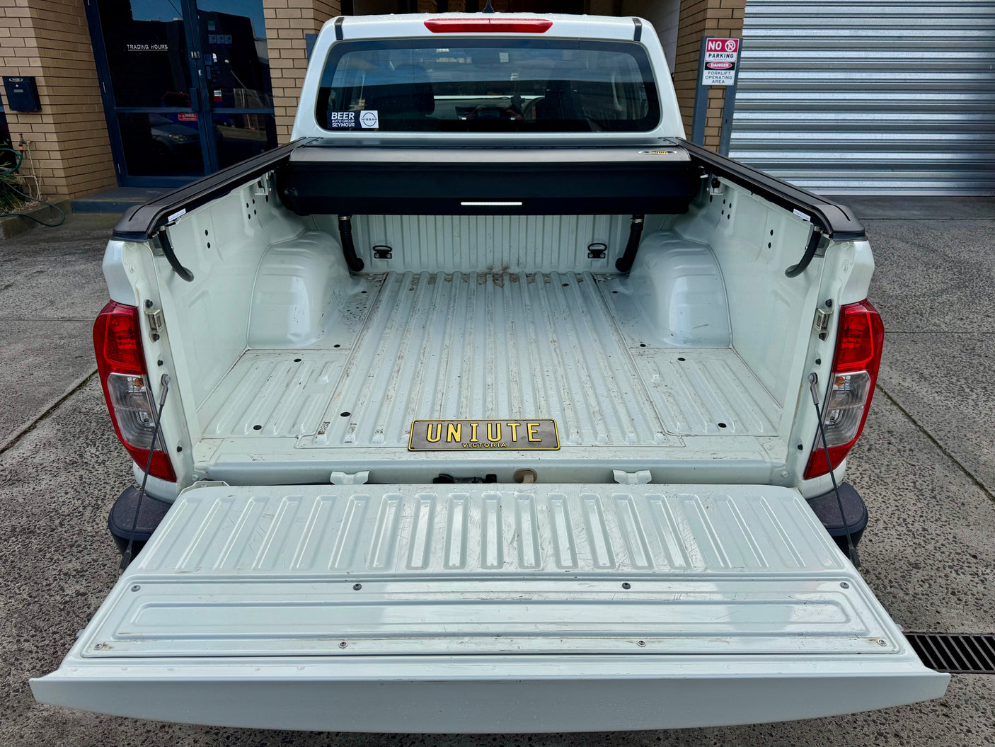 Nissan Navara NP300 roller shutter — rear three-quarter view with the shutter closed