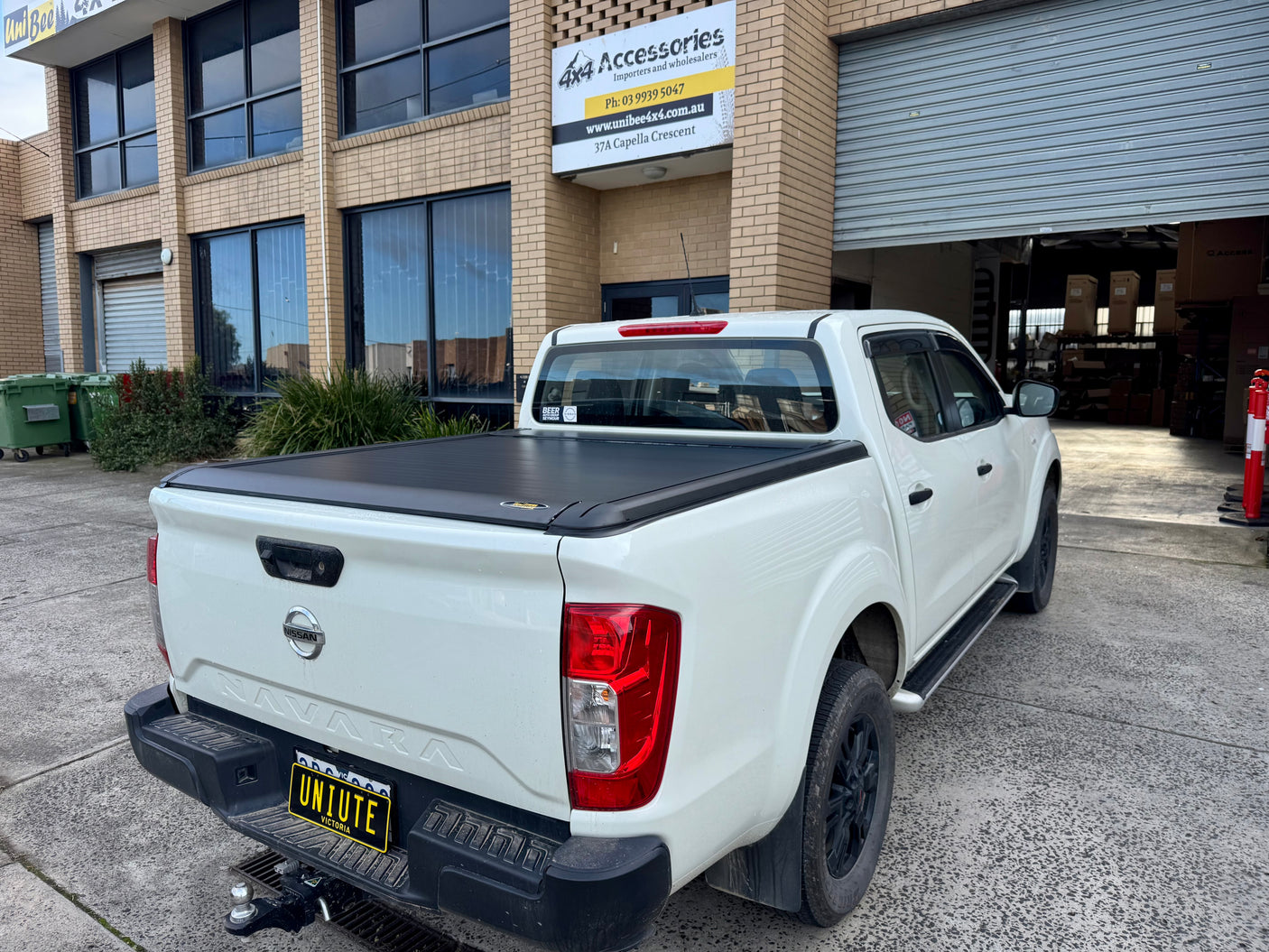 Electric roller shutter on Nissan Navara NP300 — side profile showing low-profile aluminium slats