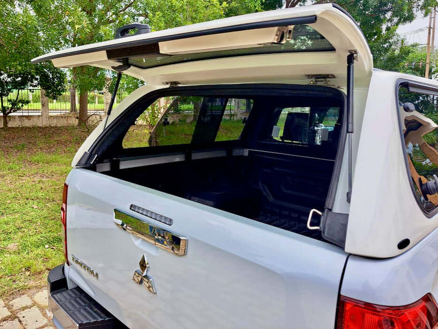 Triton Canopy Mitsubishi MV 2024+ FORCE PRO open in rear view, perfect for rugged adventures and work-ready performance.