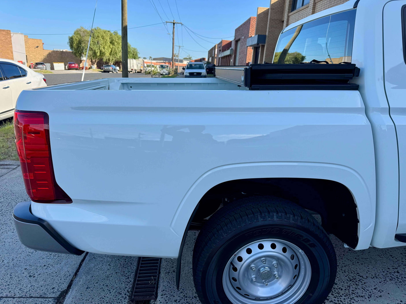 Side view of Mitsubishi Triton MV truck bed, perfect for tonneau cover mitsubishi triton fit, showcasing versatile cargo space.