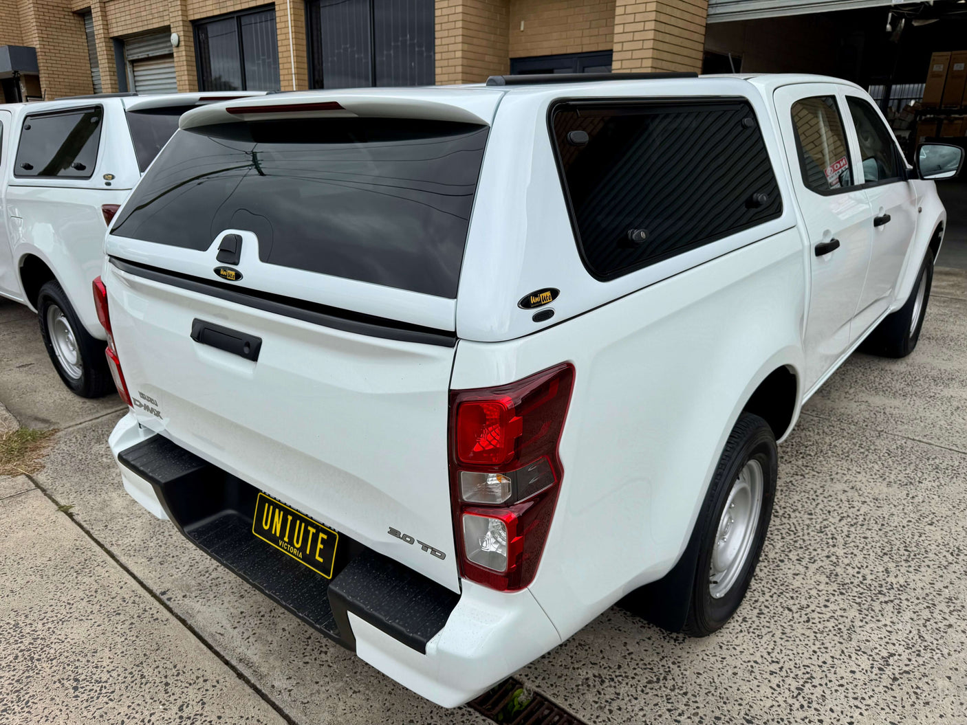 FORCE PRO canopy DMax 2020-2025 Isuzu by UniUte on a white Isuzu D-Max parked outside a workshop