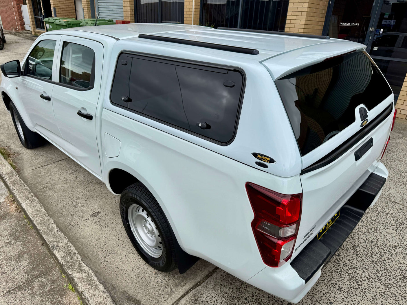 White Isuzu D-Max with FORCE PRO canopy DMax 2020-2025 by UniUte, parked on a concrete driveway in Australia