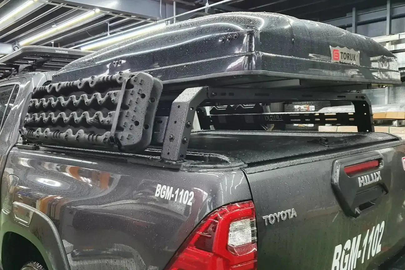 Tub rack universal multifunction utility rack on a truck, carrying rooftop tent and gear, ideal for versatile hauling.