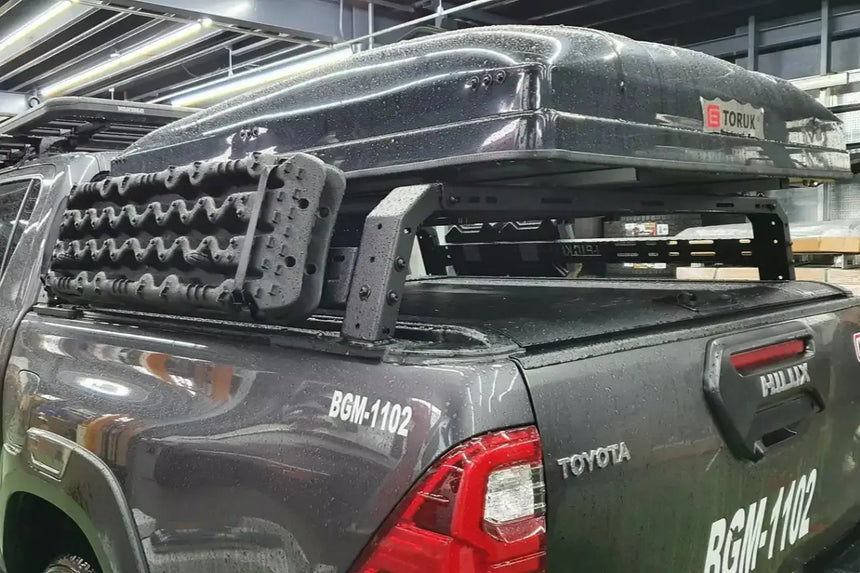Tub rack universal multifunction utility rack on a truck, carrying rooftop tent and gear, ideal for versatile hauling.