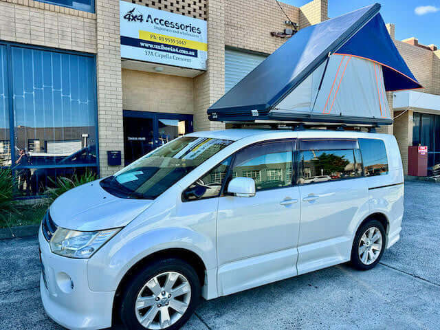 2-person hard shell tent — ladder deployed showing quick setup for 4WD touring