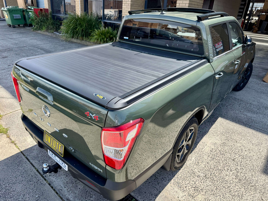 SsangYong Musso XLV with musso ute roller shutter installed, rear view, showcasing UniUte EGen2 electric design for 2018-2025 models.