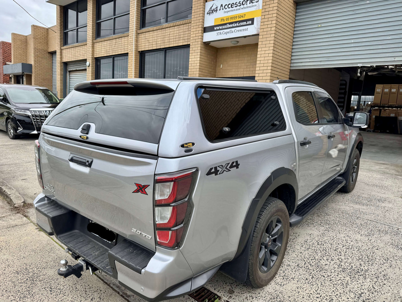 Rear view of Isuzu D-Max fitted with FORCE PRO canopy dmax 2020-2025 by UniUte in urban environment