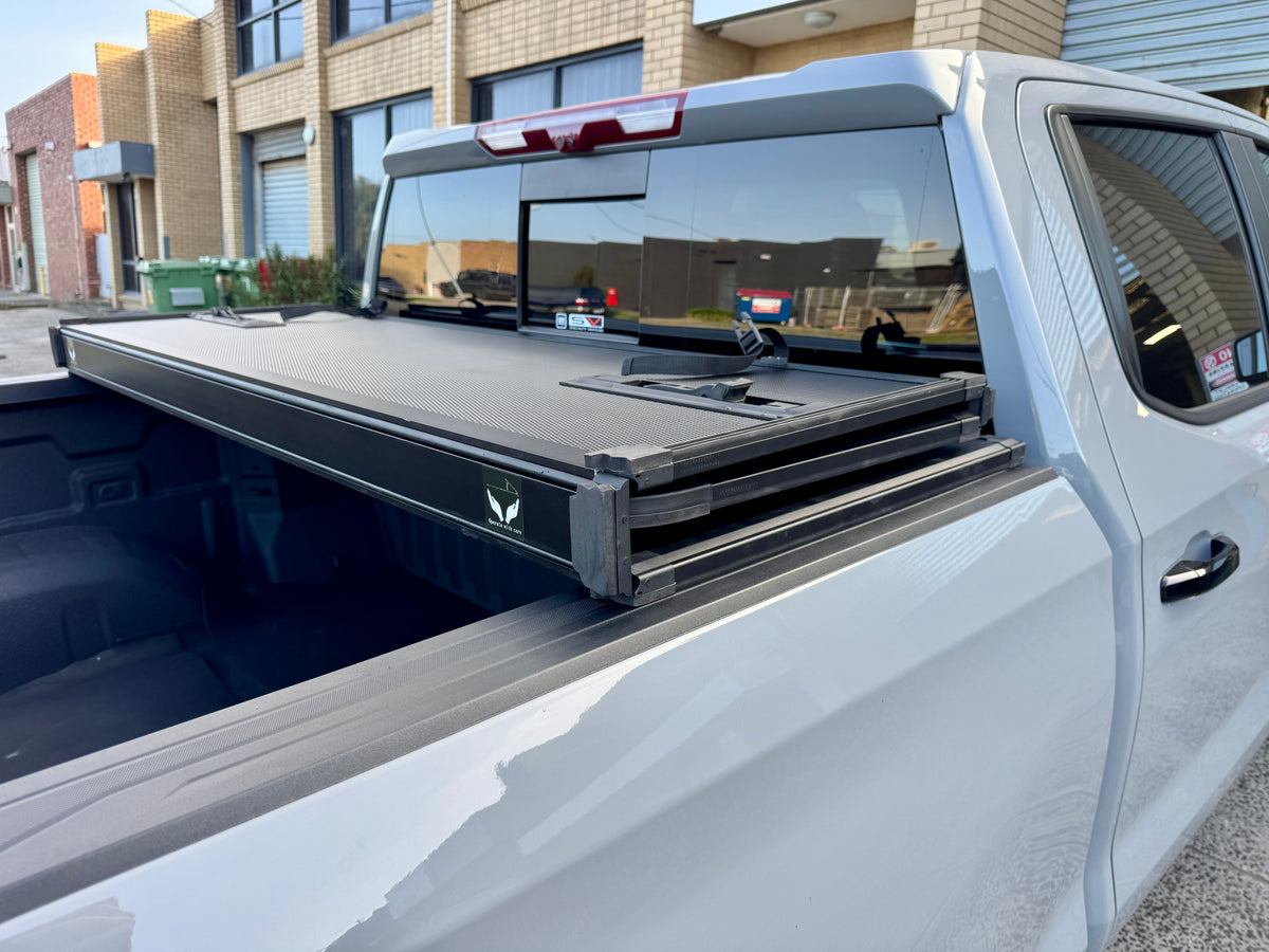 Chevrolet Silverado tri-fold lid — three-quarter rear view closed
