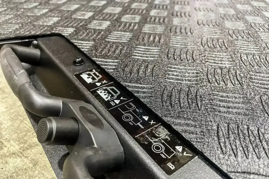 Detail of Jeep Gladiator 2020-2025 sliding tray with cargo tray design, showing textured pattern and mechanism.