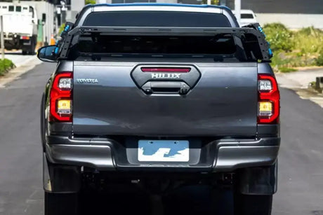 Pickup truck featuring a tub rack for versatile gear transportation on utility trips