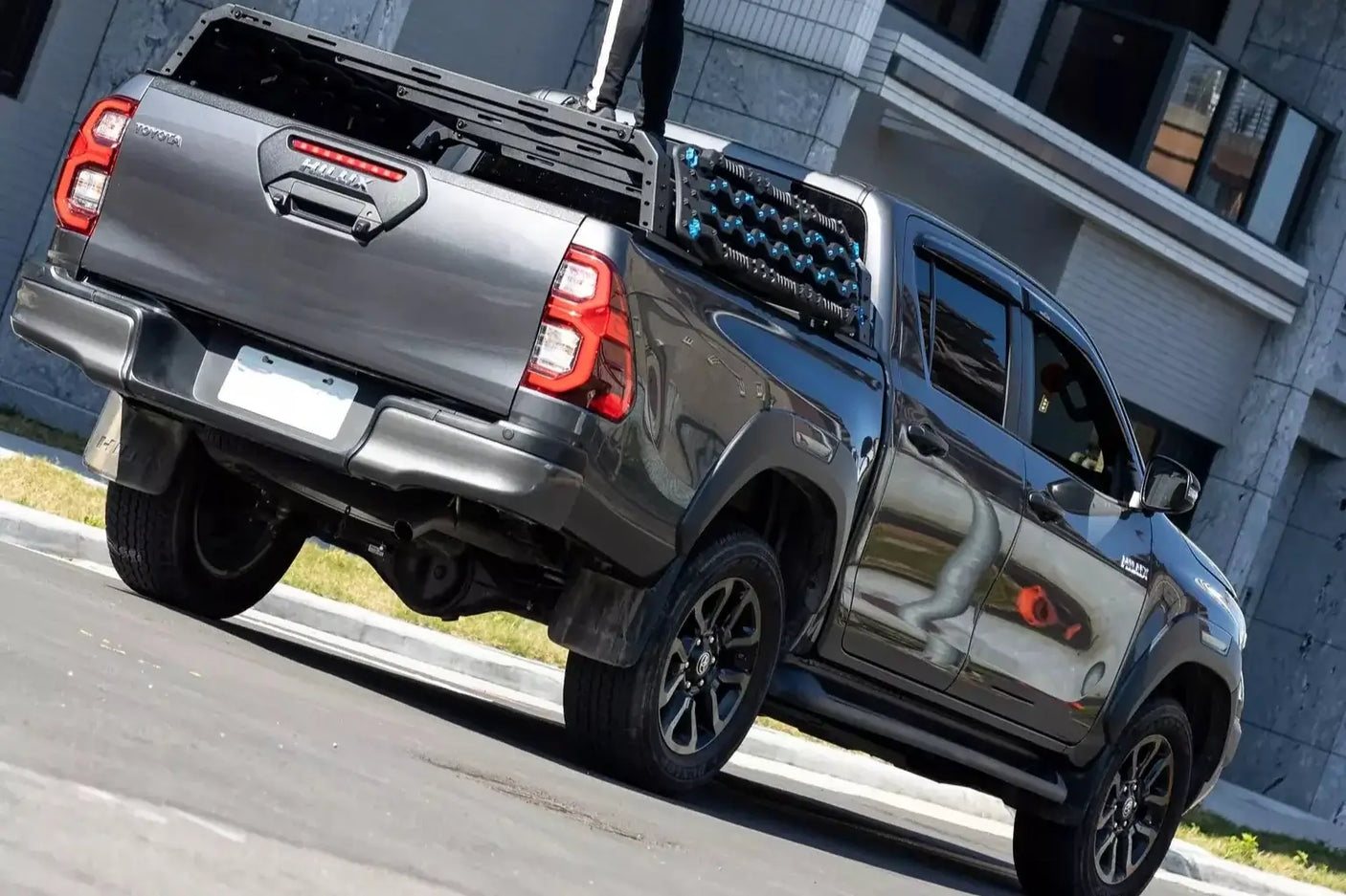 Pickup truck with universal tub rack for gear storage