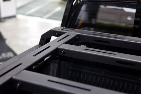 Close-up of tub rack universal multifunction utility rack carrier cage on a vehicle for hauling gear and tools.