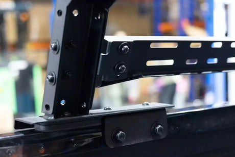 Close-up of tub rack utility multifunction carrier mounted on vehicle, showing heavy-duty construction for gear transport