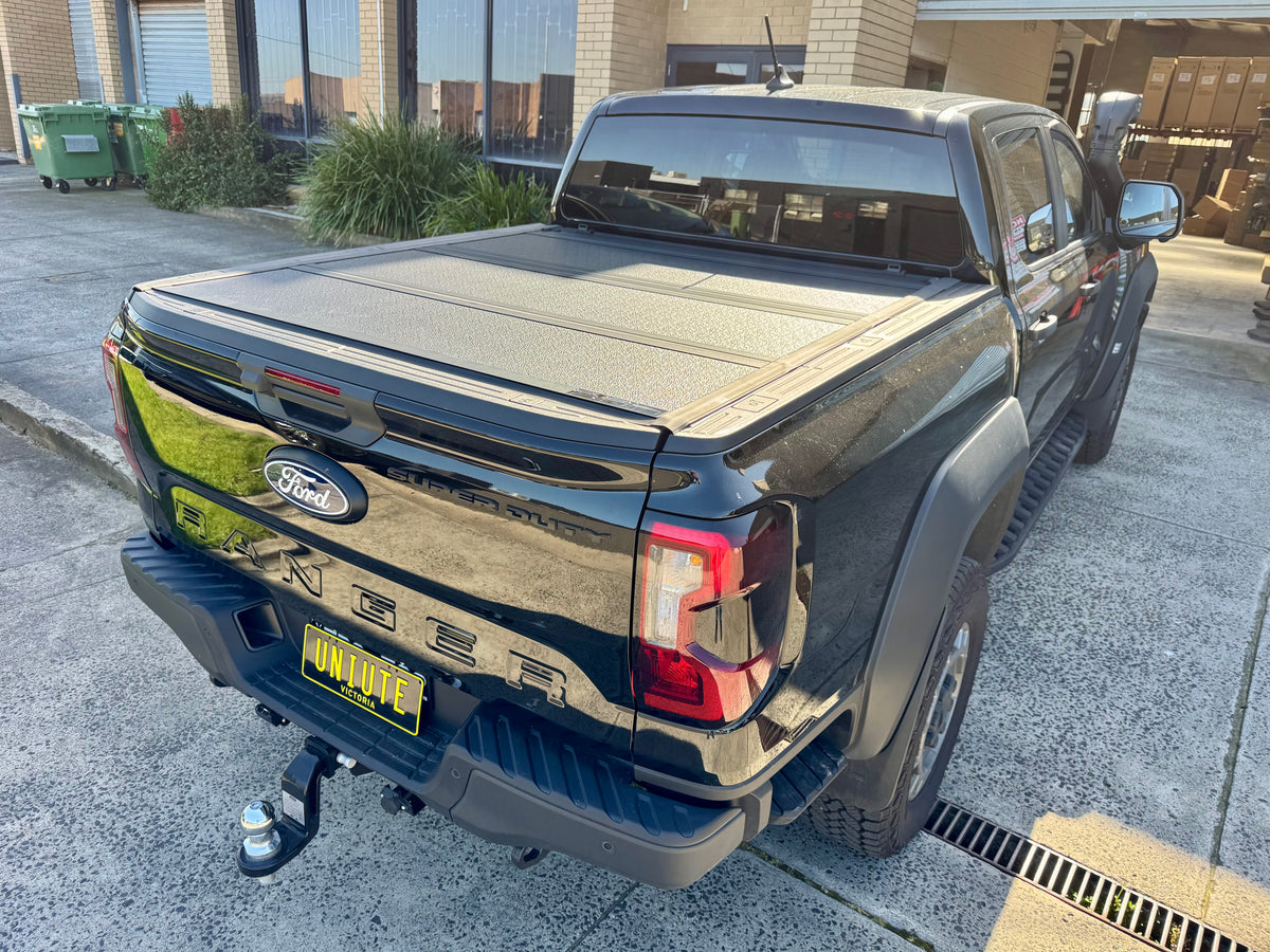 Ford Ranger NextGen with quad-fold hard lid — side view showing four-panel profile