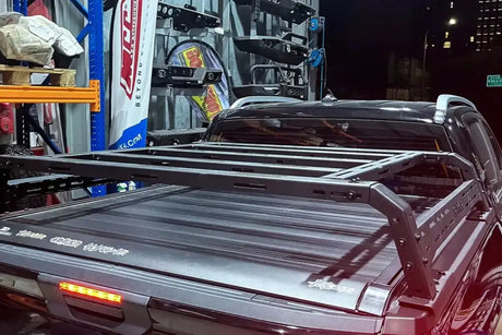 Heavy-duty tub rack mounted on a ute, perfect for carrying tools and camping gear. Universal fit multifunction utility rack carrier.