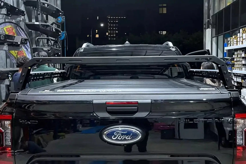 Heavy-duty tub rack installed on a truck, showcasing the Universal Utility Multifunction Rack Carrier Cage for versatile gear transport.