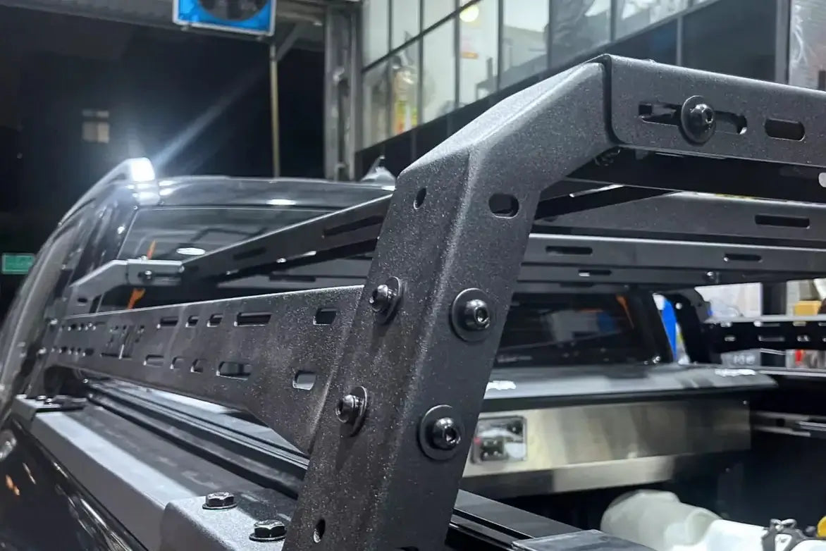 Detailed view of a heavy-duty tub rack universal multifunction utility rack carrier cage on a vehicle.
