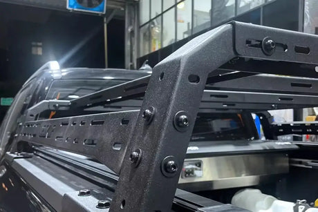 Detailed view of a heavy-duty tub rack universal multifunction utility rack carrier cage on a vehicle.