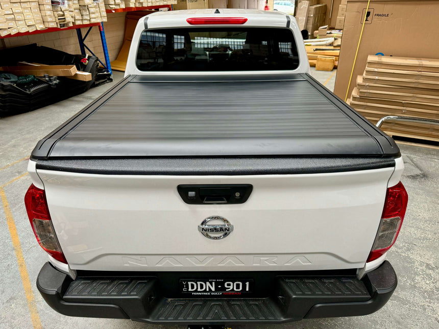 Nissan Navara with NP300 roller shutter, showcasing the UniUte EGen2 Electric Black Roller Shutter for enhanced utility and style.