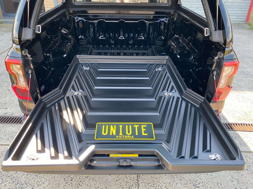 Slide out ute tray drawer installed in a Ford Ranger, showing extended UniUte sliding tray for enhanced cargo access.