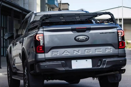 Grey Ford Ranger equipped with a tub rack utility multifunction carrier cage for secure gear transport