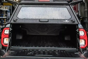 Stainless steel canopy for Nissan Navara NP300 — open view showing interior storage