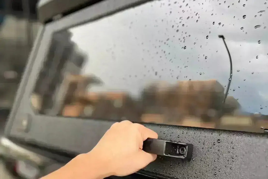 Opening KGM Musso Canopy XLV window in rain, showing stainless steel durability and rugged design for SsangYong Musso 2018-2025.