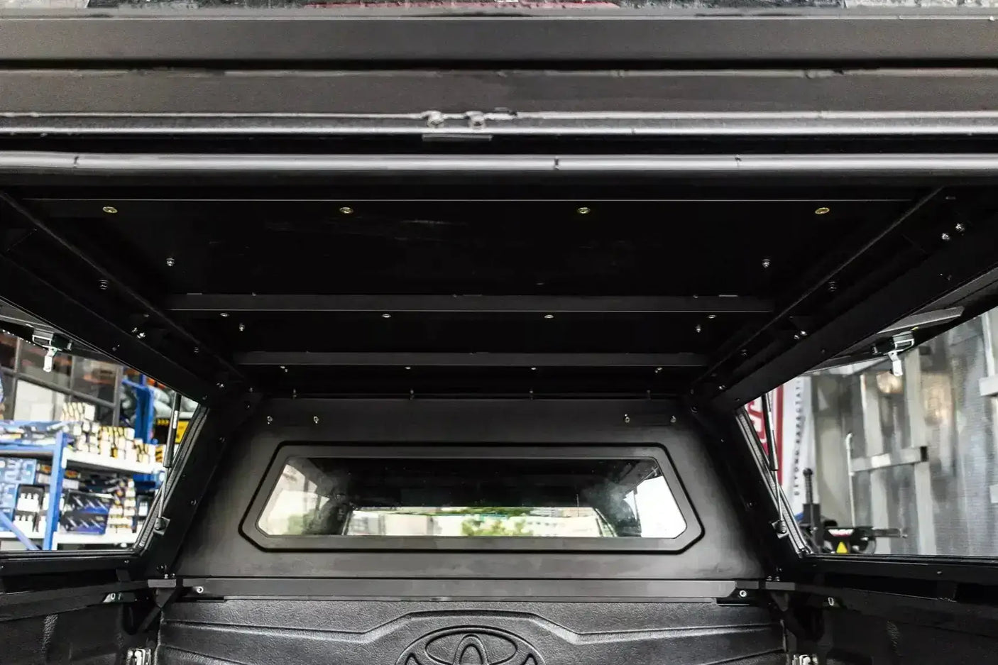 Interior view of Canopy Triton for Mitsubishi MV 2024+, featuring durable stainless steel construction for reliability and strength.