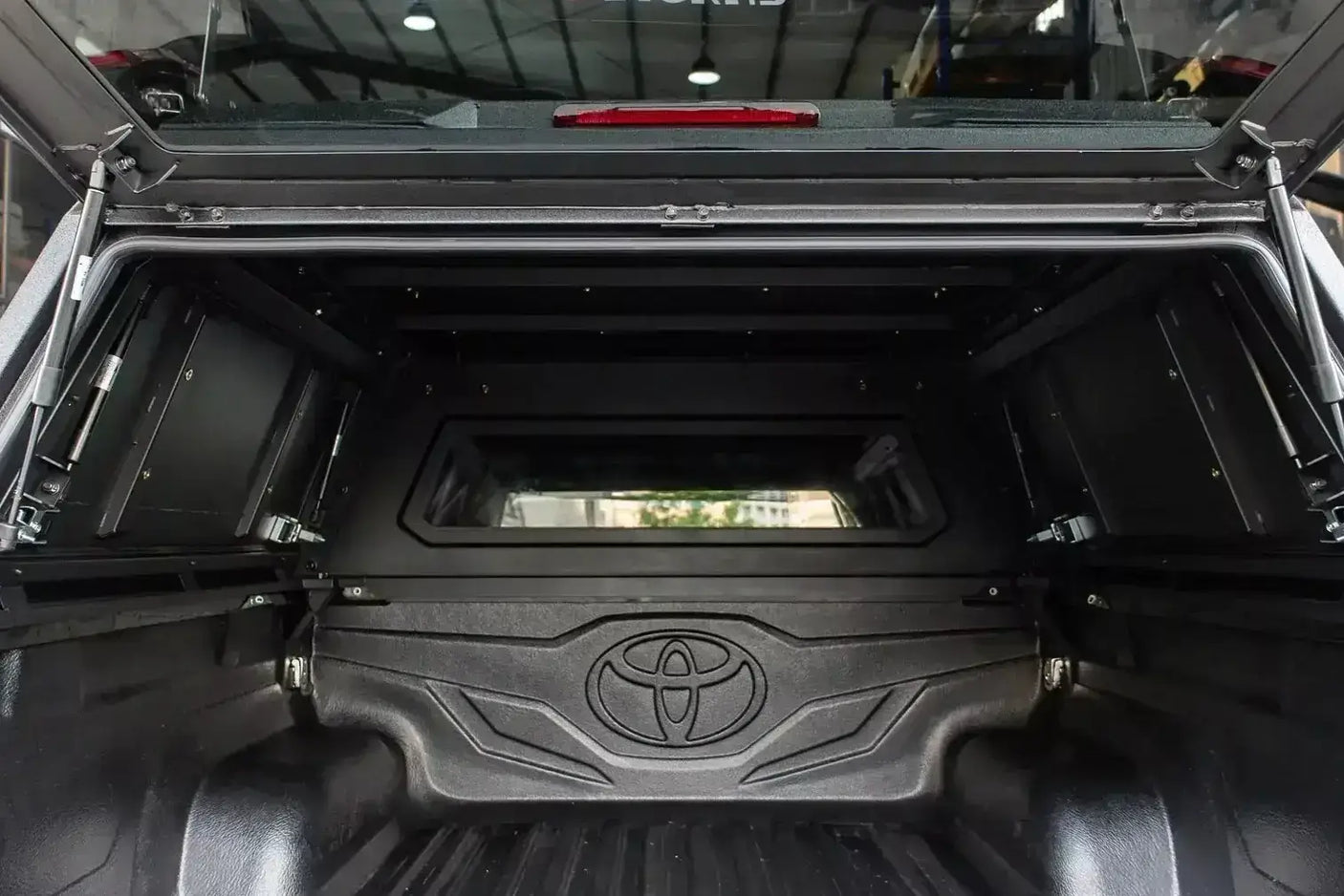 Interior view of canopy triton on Mitsubishi Triton MV 2024+ displaying durable stainless steel construction.