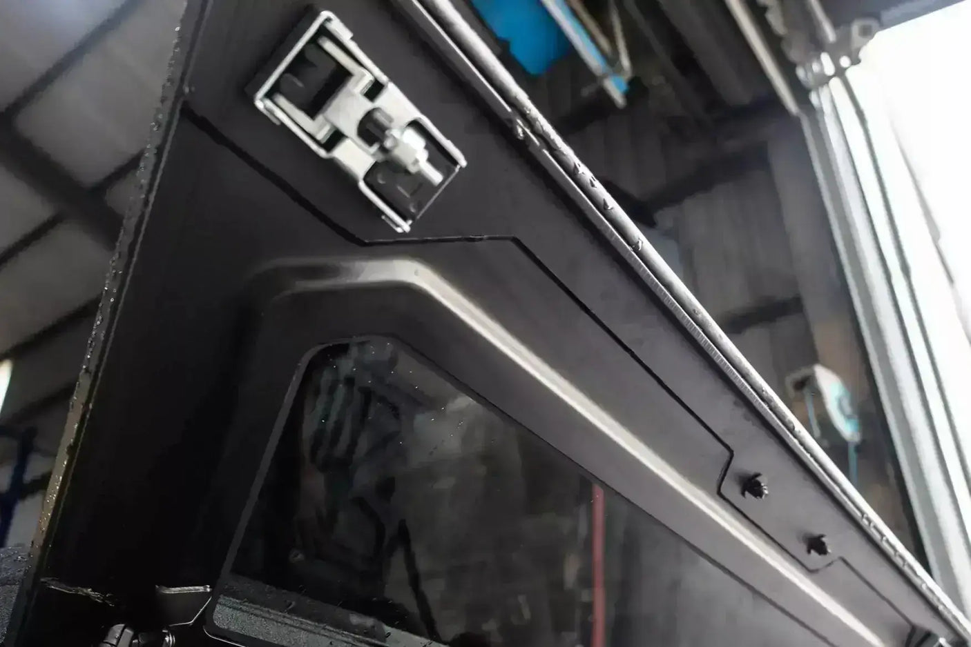 Close-up of KGM Musso Canopy for SsangYong Musso XLV 2018-2025, showing stainless steel lock detail.