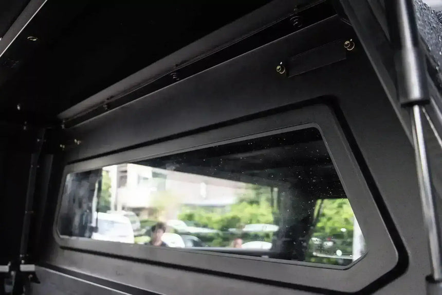 Interior view of KGM Musso canopy demonstrating stainless steel design for KGM SsangYong Musso XLV 2018-2025. Durable ute accessory.
