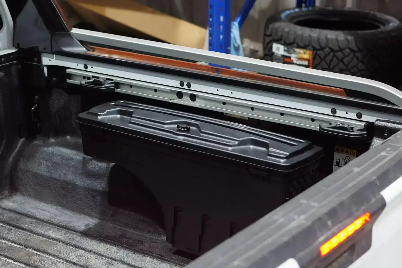 Nissan Navara tool box NP300 2021-2025 swing-out storage in truck bed, showcasing secure and functional design.