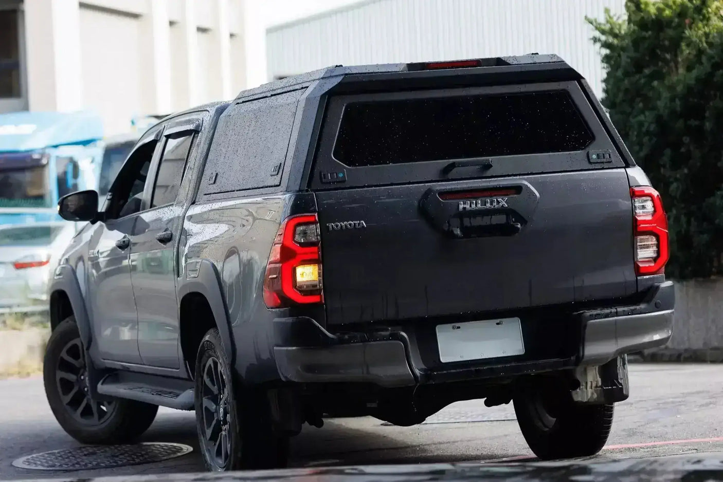 Black ute with stainless steel canopy triton MV 2024+ parked outdoors