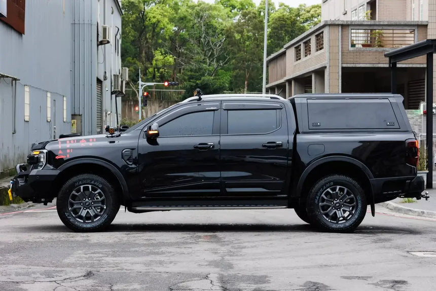 Black Ford Ranger with stainless steel canopy ford ranger NextGen 2023+ parked outside.