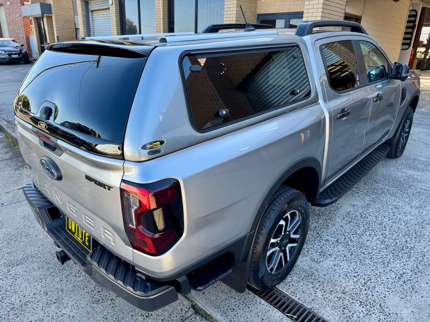 Ford Ranger Canopy NextGen RA 2022-2025 FORCE PRO showcasing versatility and style in a rugged outdoor setting.