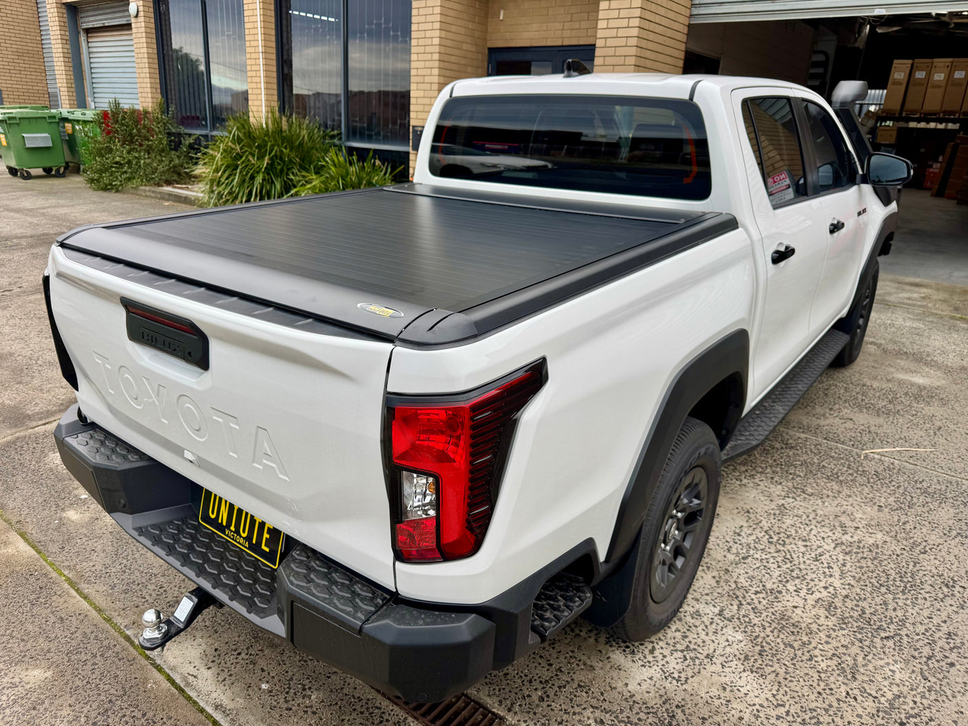 Toyota Hilux N80 N90 electric roller shutter — fully retracted showing complete tub access