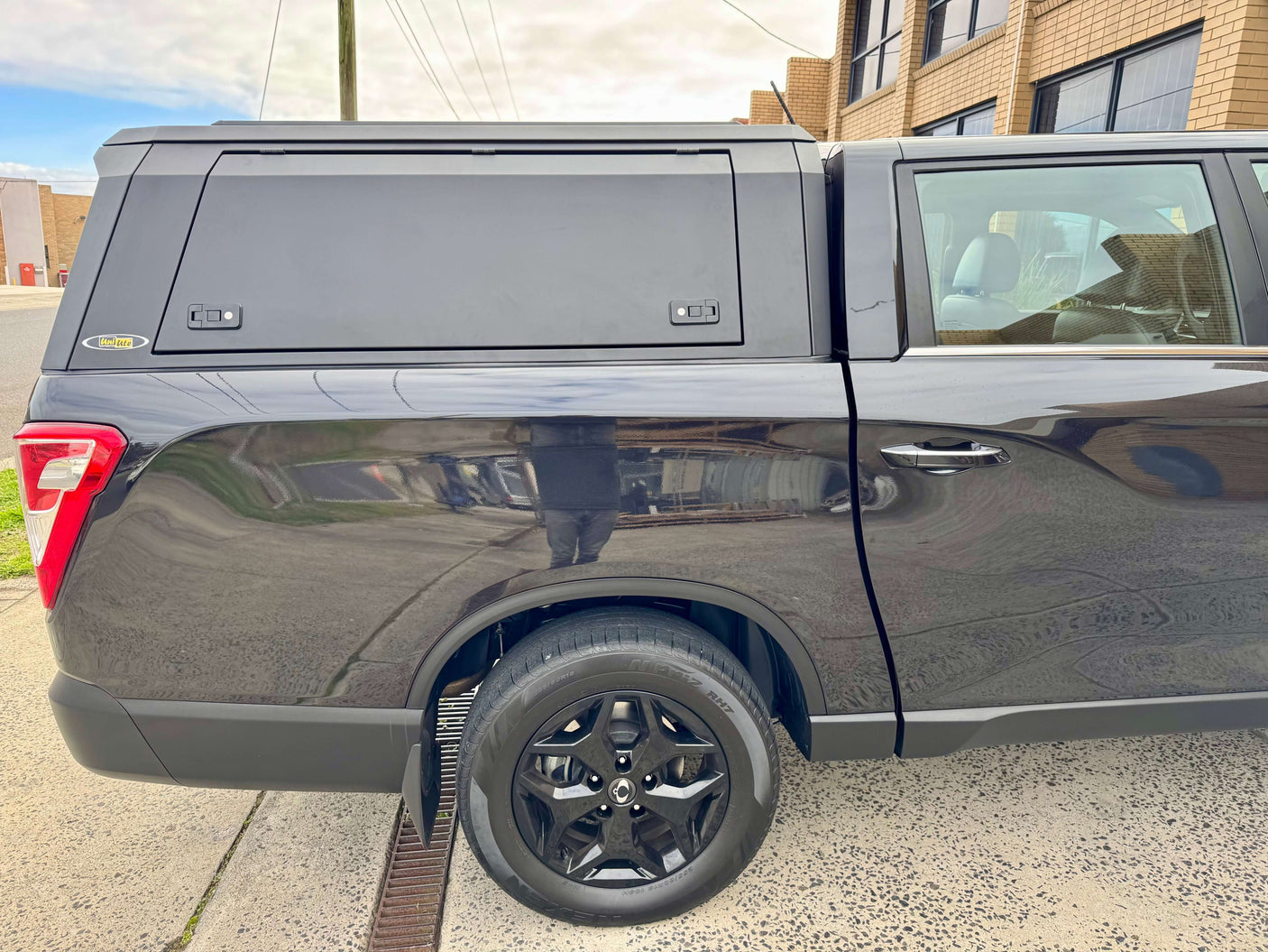KGM Musso Canopy XLV Stainless Steel Ute Canopy for 2018-2025 model, shown on a black ute, highlighting durability and style.
