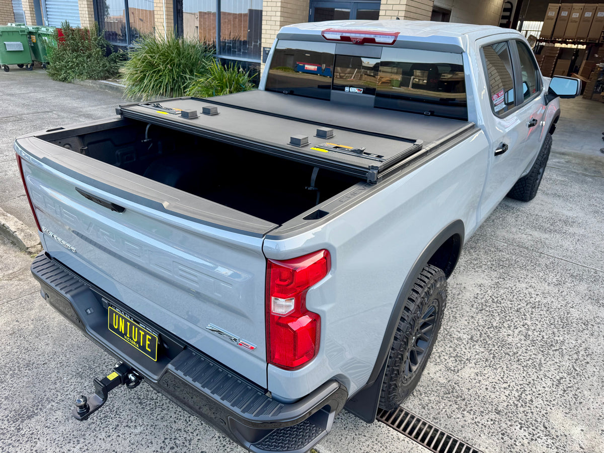 UniUte tri-fold hard lid for Silverado 1500 — rear view with panels folded