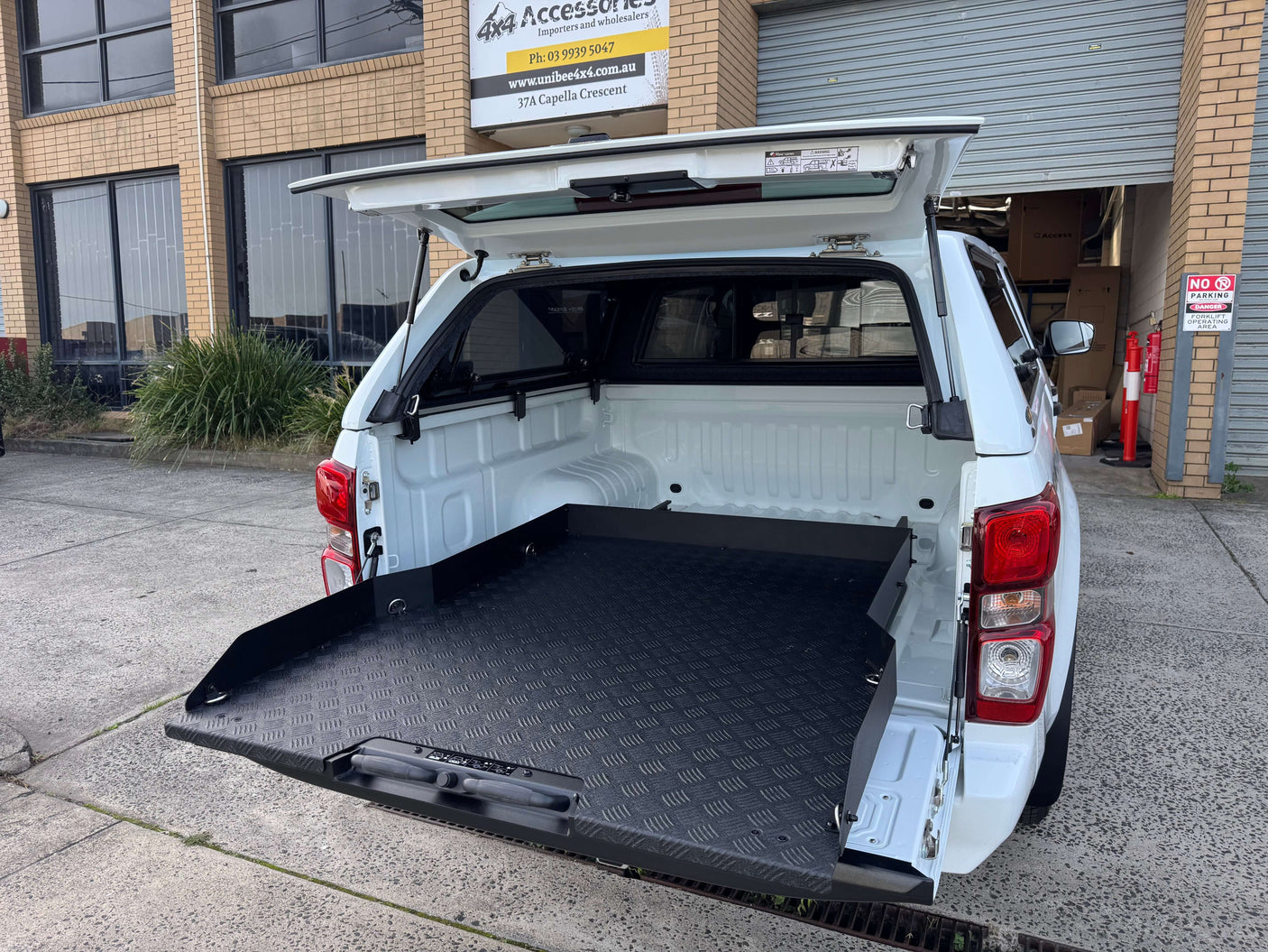Ute tray slide installed in an Isuzu D-Max truck bed, showcasing enhanced loading functionality and storage for 2012-2025 models.