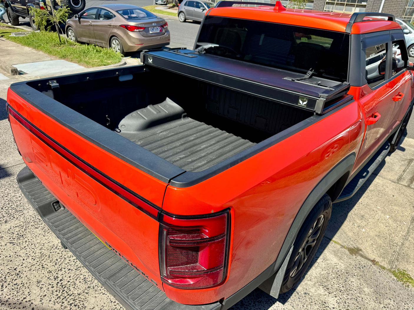 BYD Shark 6 hard lid tri-fold cover on 2025+ model ute, offering style and protection for your cargo.