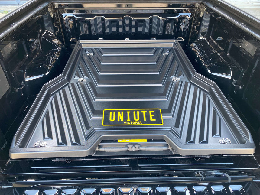 Slide out ute tray installed in a Ford Ranger showcasing UniUte sliding tray drawer for 2012-2025 models.