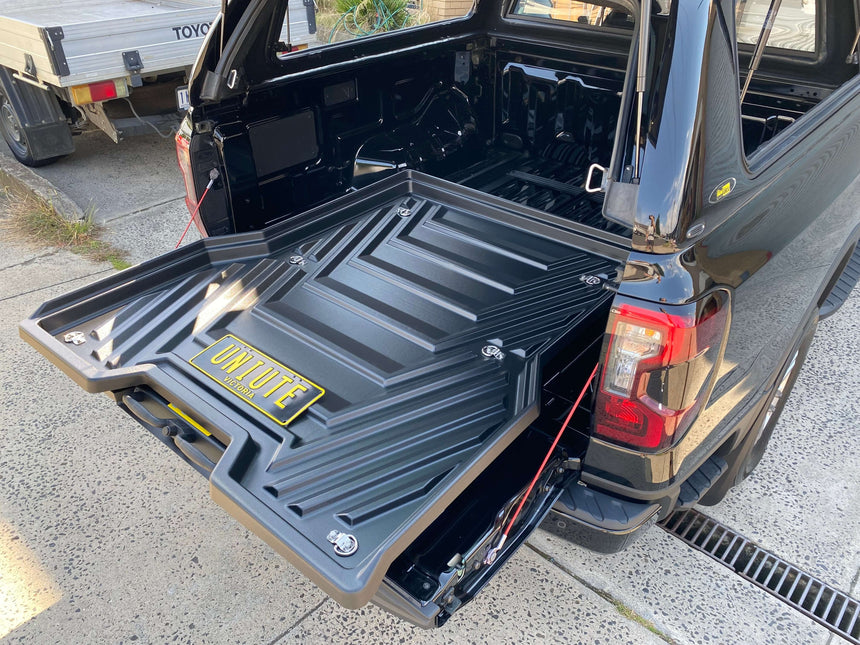 Slide out ute tray drawer installed in Ford Ranger 2012-2025 shown fully extended for optimal cargo access.