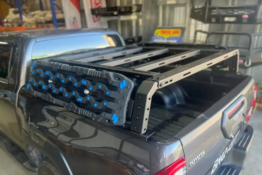 Tub rack universal multifunction utility rack carrier cage on a truck bed for hauling gear.