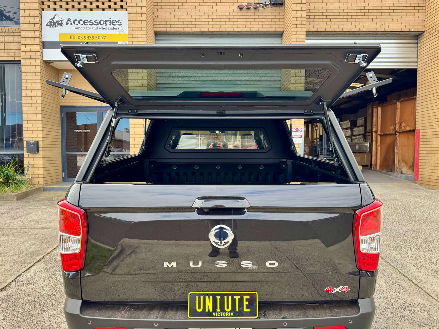 Rear view of KGM Musso Canopy XLV, stainless steel ute canopy for SsangYong Musso 2018-2025, showcasing durable design and style.