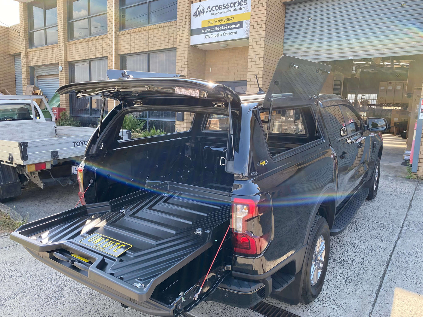 Black Ford Ranger with slide out ute tray drawer in open position